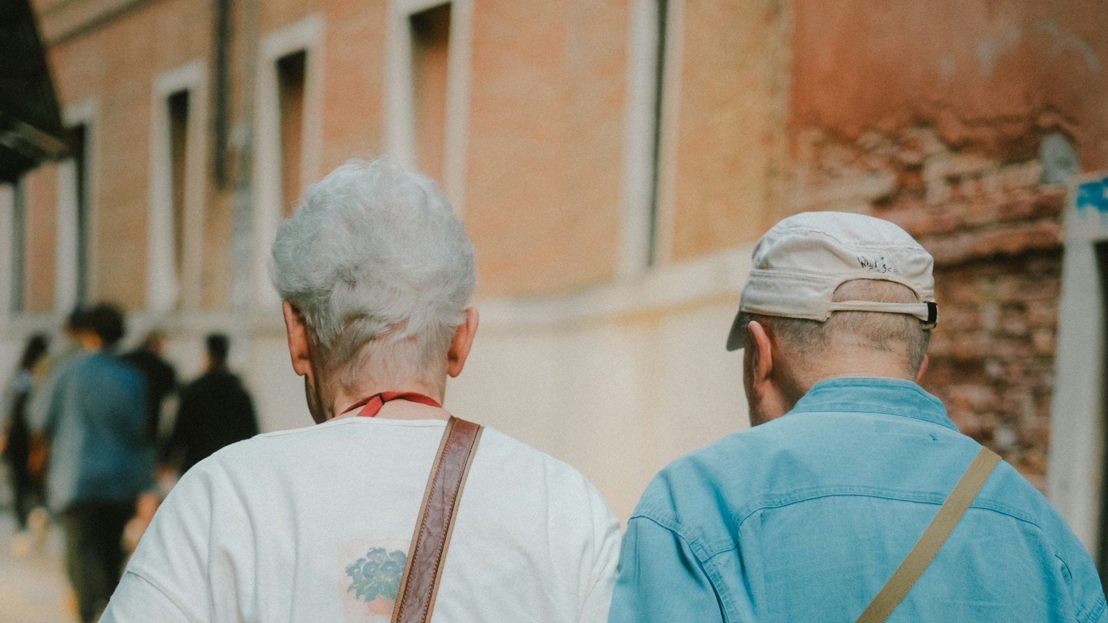 Two retirees walking together on a morning outing